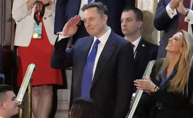 FILE - Elon Musk gestures as President Donald Trump addresses a joint session of Congress at the Capitol in Washington, March 4, 2025. (AP Photo/Alex Brandon, File)