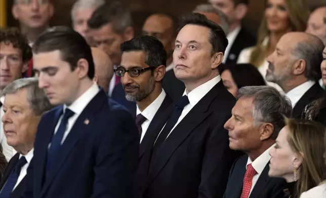 FILE - Google CEO Sundar Pichai and Elon Musk watch during the 60th Presidential Inauguration in the Rotunda of the U.S. Capitol in Washington, Jan. 20, 2025. (AP Photo/Julia Demaree Nikhinson, Pool, File)