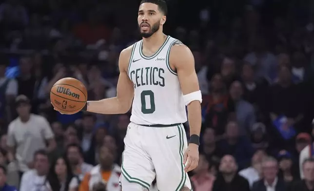 Boston Celtics' Jayson Tatum (0) looks to pass during the second half of Game 4 in the Eastern Conference semifinals of the NBA basketball playoffs against the New York Knicks Monday, May 12, 2025, in New York. (AP Photo/Frank Franklin II)