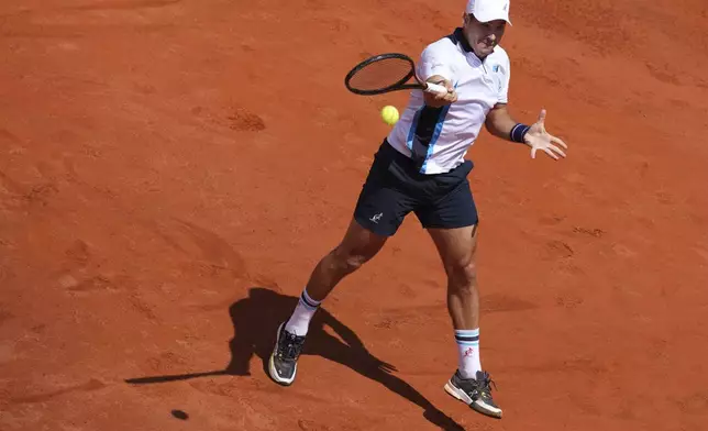 Serbia's Dusan Lajovic in action against Spain's Carlos Alcaraz during the Italian Open tennis tournament in Rome, Friday May 9, 2025. (Alfredo Falcone/LaPresse via AP)