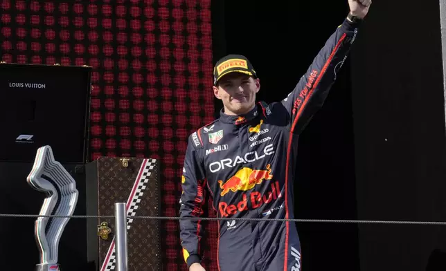 Red Bull driver Max Verstappen of the Netherlands celebrates on the podium after winning the Italian Emilia Romagna Formula One Grand Prix, at the Enzo and Dino Ferrari racetrack in Imola, Italy, Sunday, May 18, 2025. (AP Photo/Luca Bruno)