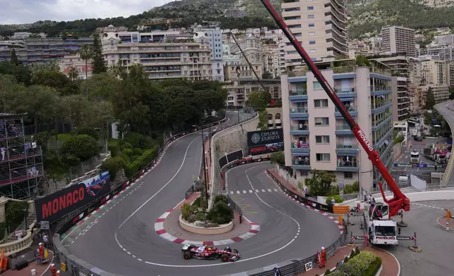 Ferrari driver Lewis Hamilton of Britain steers his car during the first free practice ahead of the Formula One Monaco Grand Prix race at the Monaco racetrack in Monaco, Friday, May 23, 2025. (AP Photo/Manu Fernandez)