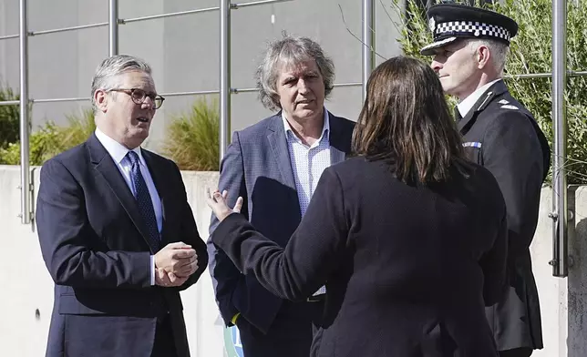 Britain's Prime Minister Keir Starmer, left, meets with Police and Crime Commissioner Emily Spurrell, second right, Deputy Chief Constable Chris Green, right, and the Mayor of Liverpool City Region, Steve Rotheram at Merseyside Police Headquarters, in Liverpool, England, Wednesday, May 28, 2025. (Peter Byrne/Pool photo via AP)