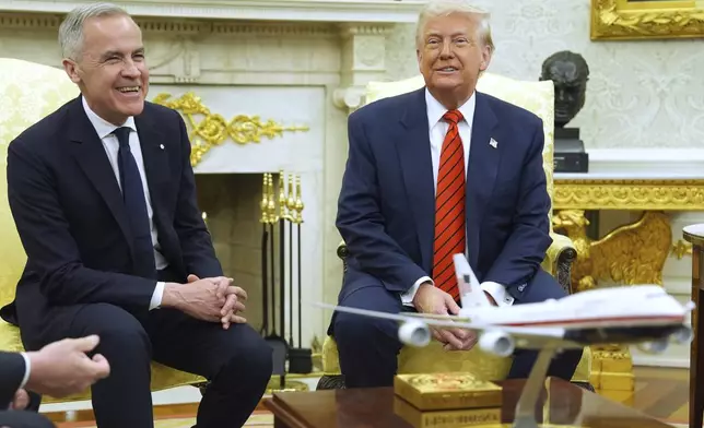 President Donald Trump meets Canadian Prime Minister Mark Carney in the Oval Office of the White House, Tuesday, May 6, 2025, in Washington. (AP Photo/Evan Vucci)