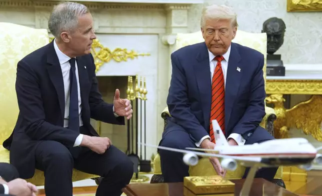 President Donald Trump meets Canadian Prime Minister Mark Carney in the Oval Office of the White House, Tuesday, May 6, 2025, in Washington. (AP Photo/Evan Vucci)