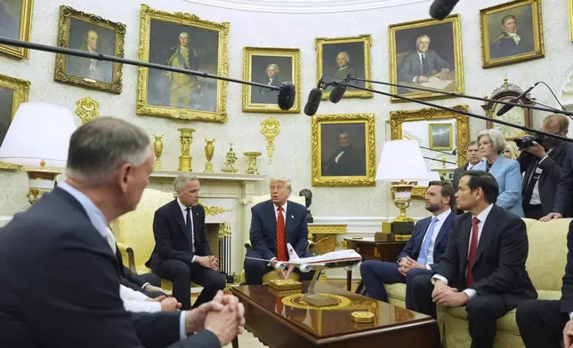 President Donald Trump meets Canadian Prime Minister Mark Carney in the Oval Office of the White House, Tuesday, May 6, 2025, in Washington. (AP Photo/Evan Vucci)