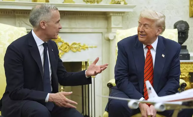 President Donald Trump meets Canadian Prime Minister Mark Carney in the Oval Office of the White House, Tuesday, May 6, 2025, in Washington. (AP Photo/Evan Vucci)