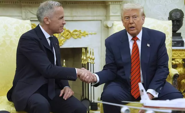 President Donald Trump meets Canadian Prime Minister Mark Carney in the Oval Office of the White House, Tuesday, May 6, 2025, in Washington. (AP Photo/Evan Vucci)