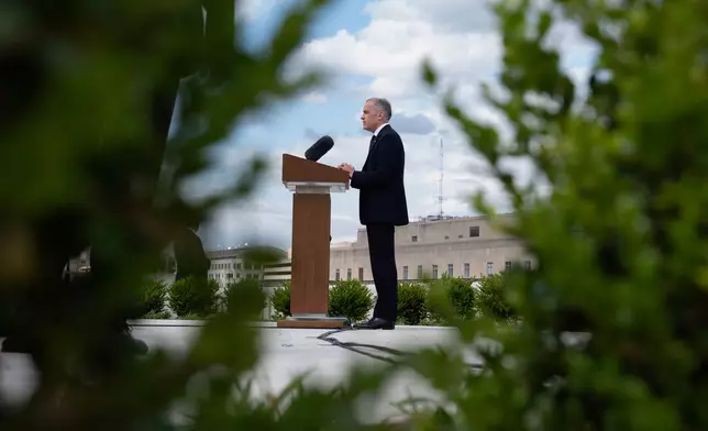 Canada's Prime Minister Mark Carney speaks with media during a news conference at the Canadian embassy in Washington, Tuesday, May 6, 2025. (Adrian Wyld/The Canadian Press via AP)