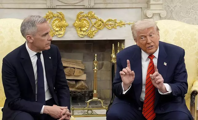 Prime Minister Mark Carney and U.S. President Donald Trump engage in a meeting at the White House in Washington, D.C., Tuesday, May 6, 2025. (Adrian Wyld /The Canadian Press via AP)