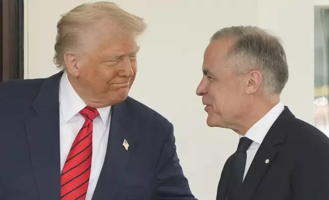 Canadian Prime Minister Mark Carney is greeted by President Donald Trump as he arrives at the West Wing of the White House, Tuesday, May 6, 2025, in Washington. (AP Photo/Mark Schiefelbein)