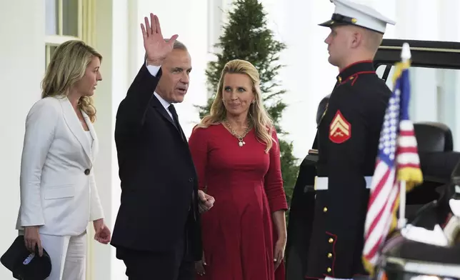 Canadian Prime Minister Mark Carney waves as he departs the White House after a meeting with President Donald Trump, Tuesday, May 6, 2025, in Washington. (AP Photo/Evan Vucci)