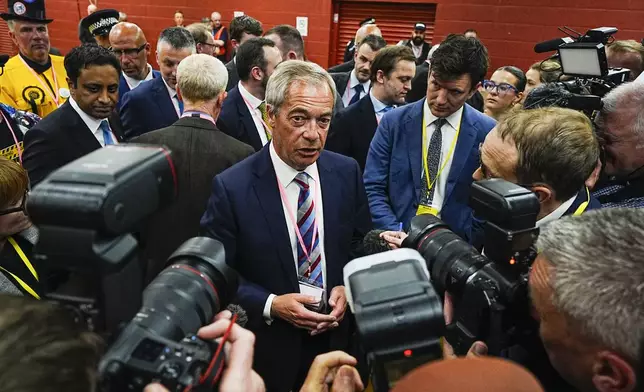 Reform UK party leader Nigel Farage talks to the media after Sarah Pochin won the Runcorn and Helsby by-election at DCBL Halton Stadium, Widnes, Cheshire, Friday, May 2, 2025. (Peter Byrne/PA via AP)