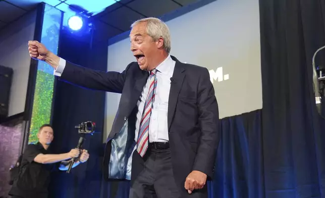 Reform UK leader Nigel Farage during a visit to The Big Club in Newton Aycliffe, England, Friday May 2, 2025. (Owen Humphreys/PA via AP)