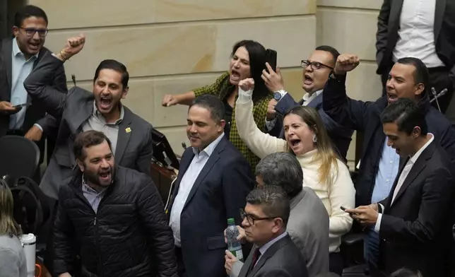 Opposition senators celebrate after voting against a labor reform referendum proposed by the government, in Bogota, Colombia, Wednesday, May 14, 2025. (AP Photo/Fernando Vergara)