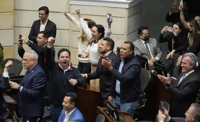 Opposition senators celebrate after voting against a labor reform referendum proposed by the government, in Bogota, Colombia, Wednesday, May 14, 2025. (AP Photo/Fernando Vergara)