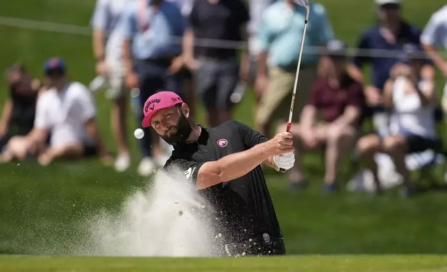 Jon Rahm, of Spain, hits from the bunker on the fourth hole during the final round of the PGA Championship golf tournament at the Quail Hollow Club, Sunday, May 18, 2025, in Charlotte, N.C. (AP Photo/George Walker IV)