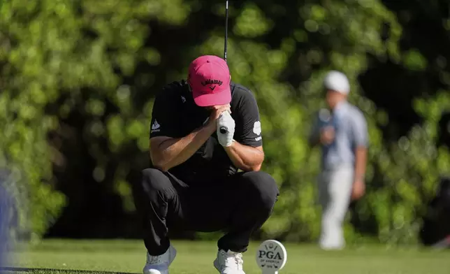 Jon Rahm, of Spain, reacts to his tee shot on the 14th hole during the final round of the PGA Championship golf tournament at the Quail Hollow Club, Sunday, May 18, 2025, in Charlotte, N.C. (AP Photo/George Walker IV)