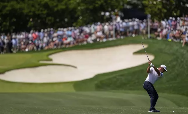 Bryson DeChambeau hits from the fairway on the first hole during the third round of the PGA Championship golf tournament at the Quail Hollow Club, Saturday, May 17, 2025, in Charlotte, N.C. (AP Photo/David J. Phillip)