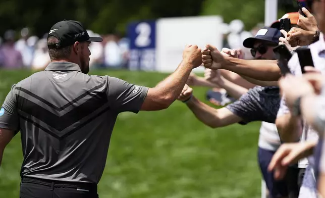 Bryson DeChambeau walks the tee on the second hole during the first round of the PGA Championship golf tournament at the Quail Hollow Club, Thursday, May 15, 2025, in Charlotte, N.C. (AP Photo/George Walker IV)