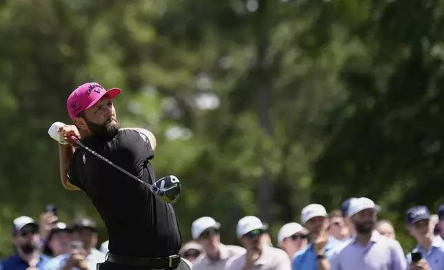 Jon Rahm, of Spain, watches his tee shot on the third hole during the final round of the PGA Championship golf tournament at the Quail Hollow Club, Sunday, May 18, 2025, in Charlotte, N.C. (AP Photo/George Walker IV)