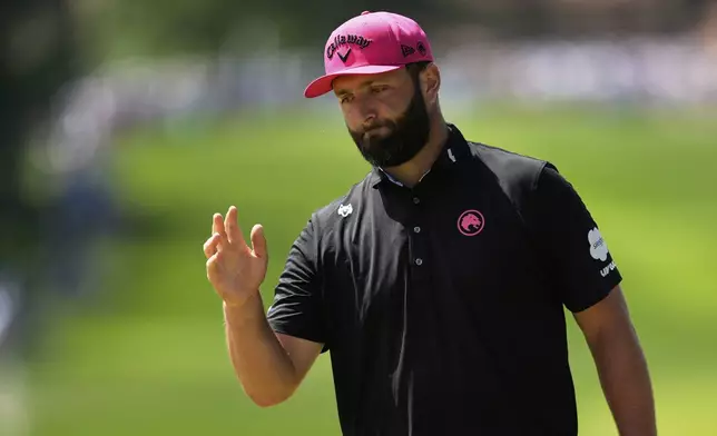 Jon Rahm, of Spain, waves after making a putt on the fifth hole during the final round of the PGA Championship golf tournament at the Quail Hollow Club, Sunday, May 18, 2025, in Charlotte, N.C. (AP Photo/George Walker IV)