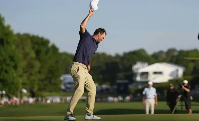 Scottie Scheffler celebrates after winning the PGA Championship golf tournament at the Quail Hollow Club, Sunday, May 18, 2025, in Charlotte, N.C. (AP Photo/George Walker IV)