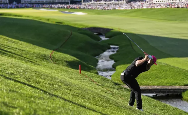 Jon Rahm, of Spain, hits from the rough on the 18th hole during the final round of the PGA Championship golf tournament at the Quail Hollow Club, Sunday, May 18, 2025, in Charlotte, N.C. (AP Photo/George Walker IV)