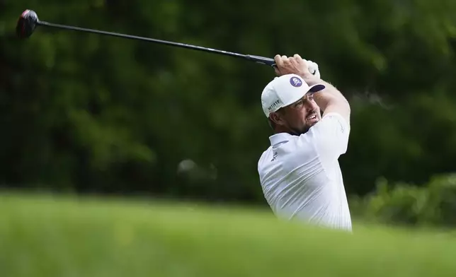 Bryson DeChambeau watches his tee shot on the 12th hole during the third round of the PGA Championship golf tournament at the Quail Hollow Club, Saturday, May 17, 2025, in Charlotte, N.C. (AP Photo/David J. Phillip)