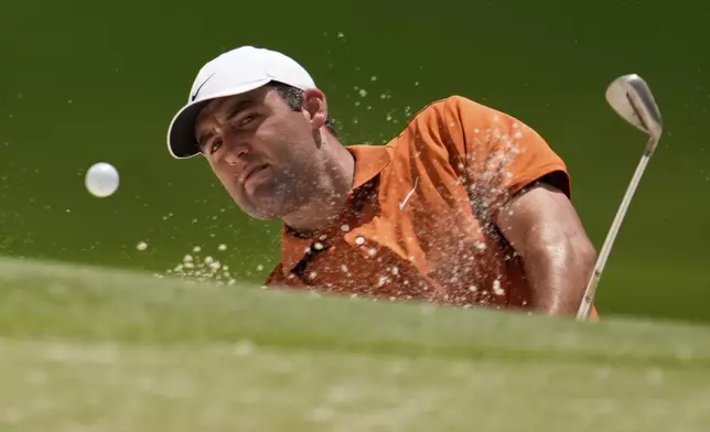 Scottie Scheffler hits from the bunker on the 15th hole during a practice round for the PGA Championship golf tournament at the Quail Hollow Club, Wednesday, May 14, 2025, in Charlotte, N.C. (AP Photo/George Walker IV)