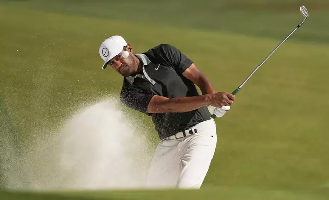 Tony Finau hits from the bunker on the 14th hole during the final round of the PGA Championship golf tournament at the Quail Hollow Club, Sunday, May 18, 2025, in Charlotte, N.C. (AP Photo/Matt York)