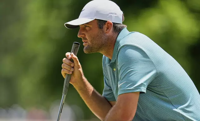 Scottie Scheffler lines up a putt on the fourth hole during the third round of the PGA Championship golf tournament at the Quail Hollow Club, Saturday, May 17, 2025, in Charlotte, N.C. (AP Photo/George Walker IV)