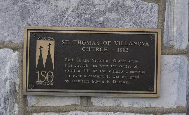 An informational sign is displayed on St. Thomas of Villanova Church on the Villanova University campus Thursday, May 8, 2025 in Villanova, Pa. (AP Photo/Matt Slocum)