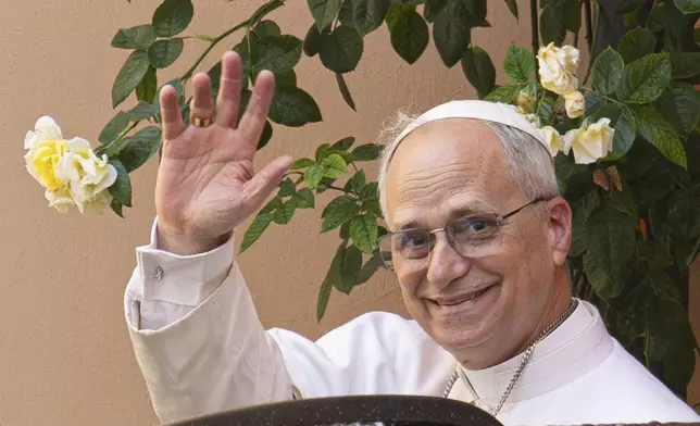 Pope Leo XIV leaves the Augustinian General House in Rome after a visit, Tuesday, May 13, 2025. (AP Photo/Domenico Stinellis)