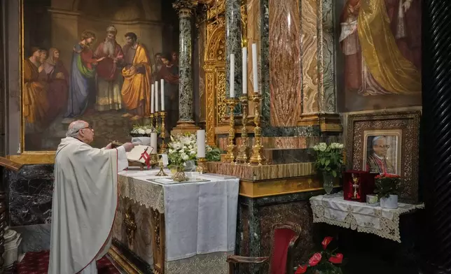 Augustinian friar Paolo Angelone celebrates Mass in the Sanctuary of Our Mother of Good Counsel in Genazzano, Italy, Thursday, May 15, 2025. (AP Photo/Gregorio Borgia)