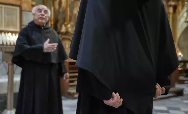 Augustinian friars Alberto Giovannetti, right, and Paolo Angelone speak during an interview in the Sanctuary of Our Mother of Good Counsel in Genazzano, Italy, Thursday, May 15, 2025. (AP Photo/Gregorio Borgia)