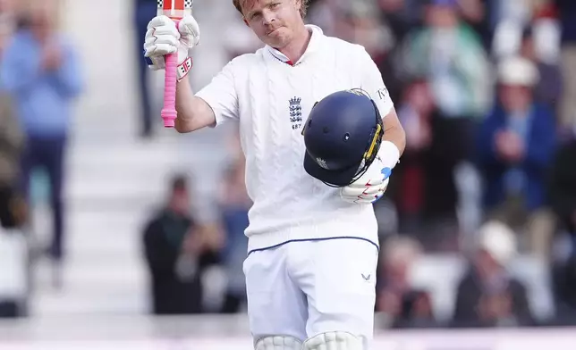 England's Ollie Pope celebrates his century on day one of the International test series cricket match between England and Zimbabwe at Trent Bridge, Nottingham, England, Thursday May 22, 2025. (Mike Egerton/PA via AP)