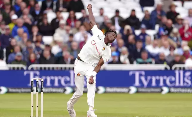 Zimbabwe's Blessing Muzarabani in action on day one of the Rothesay International Test series cricket match between England and Zimbabwe in Nottingham, England, Thursday May 22, 2025. (Mike Egerton/PA via AP)