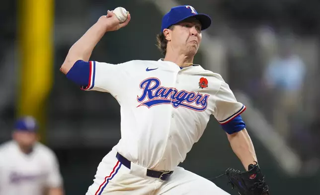 Texas Rangers starting pitcher Jacob deGrom throws a pitch to the Toronto Blue Jays during the first inning of a baseball game, Monday, May 26, 2025, in Arlington, Texas. (AP Photo/Julio Cortez)