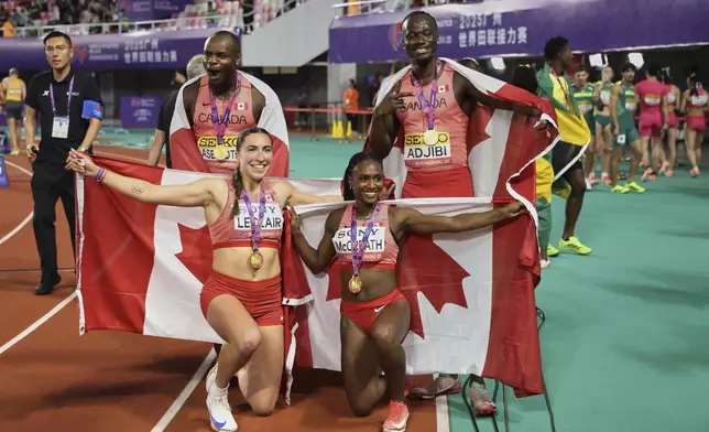 Canada sprinters from left; Duan Asemota, Marie-ÉLoise Leclair, Sade Mccreath, and Eliezer Adjibi celebrate after winning the gold medals in 4x100 meters mixed relay at the World Athletics Relay, in Guangzhou in south China's Guangdong province on Sunday, May 11, 2025. (Chinatopix Via AP)