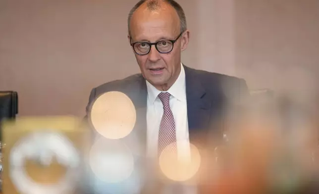 German Chancellor Friedrich Merz arrives for the cabinet meeting at the chancellery in Berlin, Germany, Wednesday, May 28, 2025. (AP Photo/Markus Schreiber)