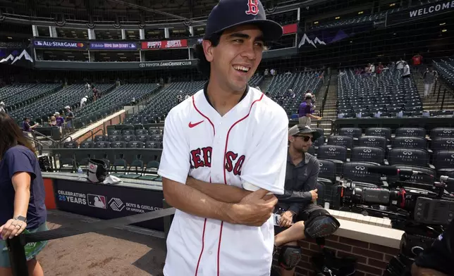 FILE - Boston Red Sox first round draft pick Marcelo Mayer watches batting practice for the MLB All-Star baseball game, Monday, July 12, 2021, in Denver. (AP Photo/David Zalubowski,File)
