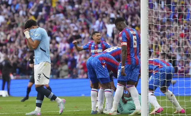 Manchester City's Omar Marmoush reacts after missing a penalty during the English FA Cup final soccer match between Crystal Palace and Manchester City at Wembley stadium in London, Saturday, May 17, 2025. (AP Photo/Kirsty Wigglesworth)