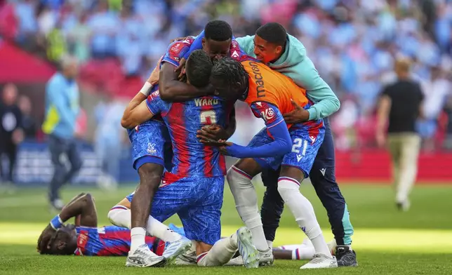 Crystal Palace players celebrate after winning the English FA Cup final soccer match between Crystal Palace and Manchester City at Wembley stadium in London, Saturday, May 17, 2025. (AP Photo/Kirsty Wigglesworth)