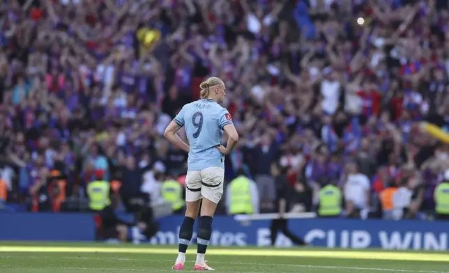 Manchester City's Erling Haaland stands dejected after the FA Cup final between Manchester City and Crystal Palace at the Wembley Stadium in London, Saturday, May 17, 2025. (AP Photo/Ian Walton)