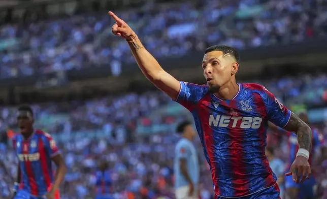 Crystal Palace's Daniel Munoz celebrates a goal that was later disallowed by a VAR decision the English FA Cup final soccer match between Crystal Palace and Manchester City at Wembley stadium in London, Saturday, May 17, 2025. (AP Photo/Kirsty Wigglesworth)