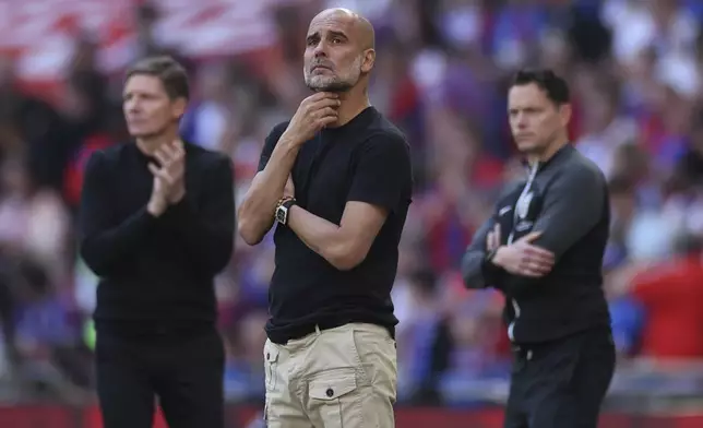 Manchester City's head coach Pep Guardiola reacts during the FA Cup final between Manchester City and Crystal Palace at the Wembley Stadium in London, Saturday, May 17, 2025. (AP Photo/Ian Walton)