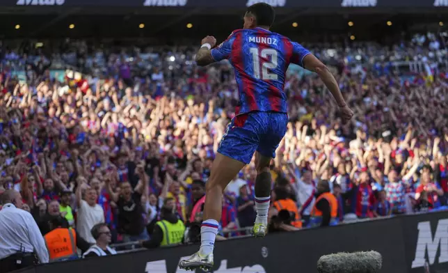 Crystal Palace's Daniel Munoz celebrates a goal that was later disallowed by a VAR decision during the English FA Cup final soccer match between Crystal Palace and Manchester City at Wembley stadium in London, Saturday, May 17, 2025. (AP Photo/Kirsty Wigglesworth)