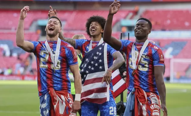 Crystal Palace players celebrate after the FA Cup final between Manchester City and Crystal Palace at the Wembley Stadium in London, Saturday, May 17, 2025. (AP Photo/Ian Walton)