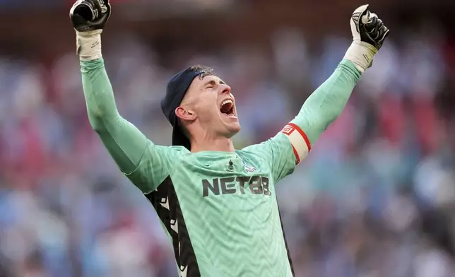 Crystal Palace goalkeeper Dean Henderson celebrates after the English FA Cup final soccer match between Crystal Palace and Manchester City at Wembley stadium in London, Saturday, May 17, 2025. (Adam Davy/PA via AP)
